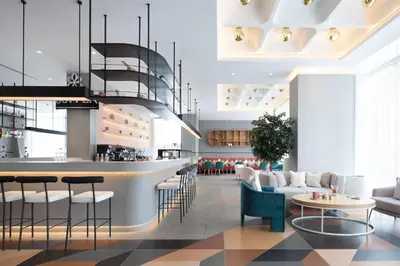 a rendering of a lobby with a bar at Ecos Dubai Hotel at Al Furjan in Dubai