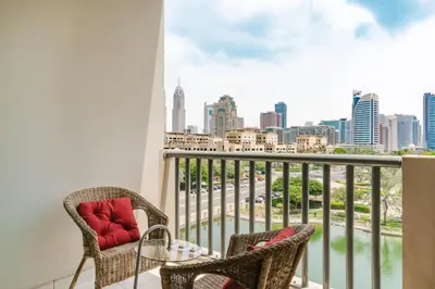 a balcony with chairs and a view of the city at RH - Beautiful canal view, Sleek & spacious Studio, central location in Dubai