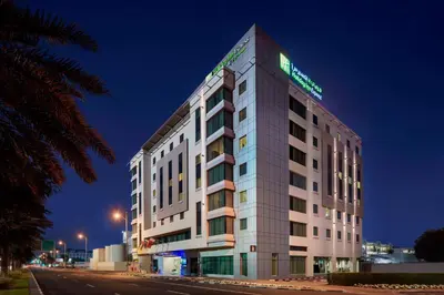 a rendering of a hotel at night at Holiday Inn Express Dubai, Jumeirah by IHG in Dubai