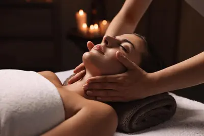 a woman getting a massage in a spa room at Holiday Inn Express Dubai, Jumeirah by IHG in Dubai