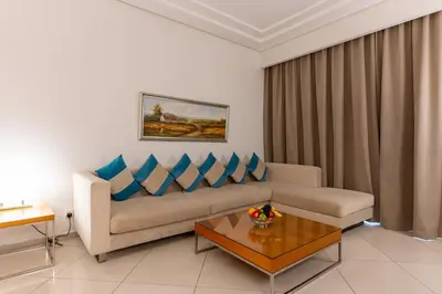a living room with a couch and a coffee table at Belle Vue Building in Dubai