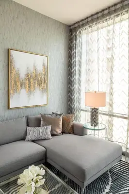 a living room with a couch and a window at Royal Club By RVHR, Noora Tower, Al Habtoor City, Business Bay in Dubai