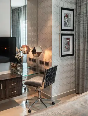 a office with a glass desk and a chair at Royal Club By RVHR, Bonnington Residential Tower - JLT in Dubai