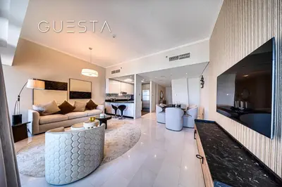 a living room with a couch and a table at Cayan Tower, Dubai Marina in Dubai