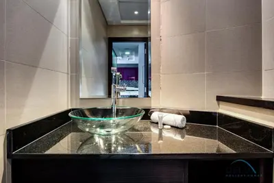 a bathroom with a bowl sink on a counter at Sea Views 1BR in the Heart of Dubai Marina by Deluxe Holiday Homes in Dubai