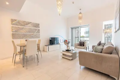 a living room with a couch and a table at Sea Views 1BR in the Heart of Dubai Marina by Deluxe Holiday Homes in Dubai