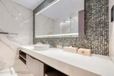 a bathroom with a sink and a mirror at Palm Jumeirah Luxury Apartments by Propr in Dubai
