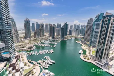 an aerial view of a city with boats in a harbor at Dream Inn - Damac Heights by Fendi in Dubai