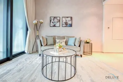a living room with a couch and a table at Captivating 1BR at The Address Residences in JBR by Deluxe Holiday Homes in Dubai