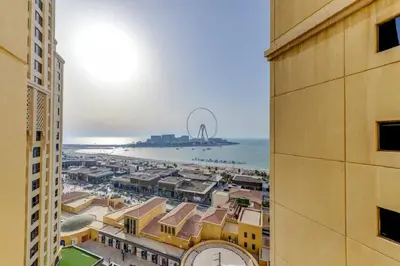a view of the beach from between two buildings at VIP Castles JBR Rimal 3 Suite 1 Bedroom in Dubai