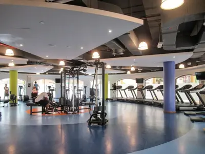 a gym with a bunch of treadmills and machines at Frank Porter - Murjan 6 in Dubai
