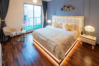a bedroom with a large bed and a window at FIRST CLASS 2BR with full BURJ KHALIFA and FOUNTAIN VIEW in Dubai