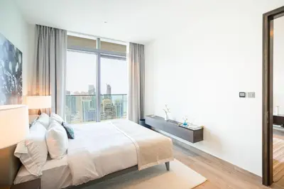a bedroom with a large bed and a large window at Luton Vacation Homes - Marina View & Luxury 1BR - Jumeirah Living Marina Gate Tower 3 - 54AB49AB36AB in Dubai