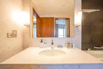 a bathroom with a sink and a mirror at New Arabian -Address Emaar Fashion Avenue in Dubai