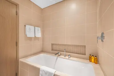 a bathroom with a large tub in a room at EDEN'S Homes & Villas - 52-42 Emaar in Dubai