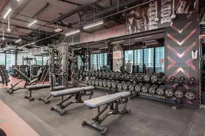 a gym with rows of dumbbells and weights at Tranquil Retreat with Canal View 1BR MBL Residence - 29AB12 in Dubai