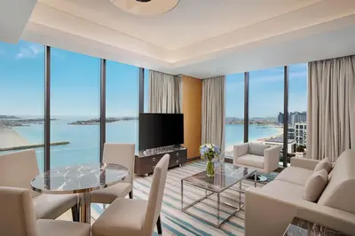 a living room with a view of the ocean at Hilton Dubai Palm Jumeirah in Dubai