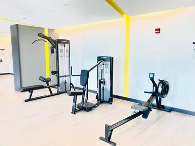 a gym with two treadmills and two exercise bikes at Ultimate Luxury at Dubai Creek Horizon Waterfront in Dubai