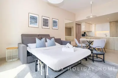 a living room with a bed and a kitchen at LUX Contemporary Suite with Marina View 3 in Dubai