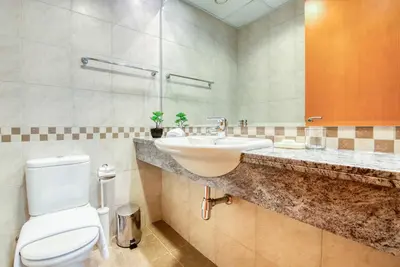 a bathroom with a sink and a toilet at Manazel Al Safa in Dubai in Dubai