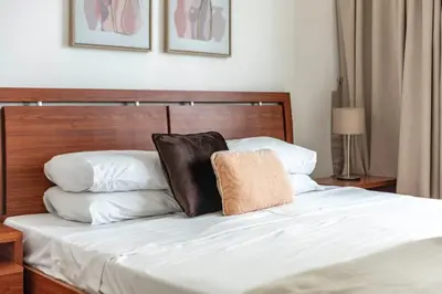 a bed with two pillows on top of it at GuestReady - Marina Views | 1BR + Pool & Gym in Dubai