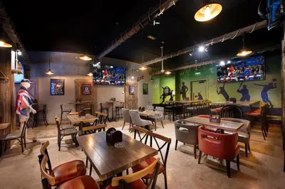 a restaurant with tables and chairs in a room at Grandeur Hotel Al Barsha in Dubai