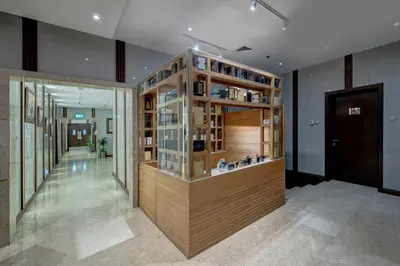 a room with a display case in a building at Grandeur Hotel Al Barsha in Dubai