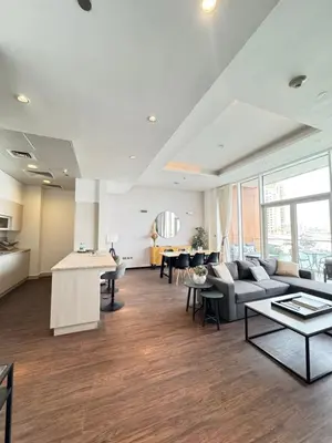 a living room with a couch and a table at Palm Jumeirah 1BR luxurious & gorgeous view in Dubai