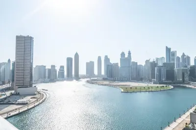 a view of a river in a city with buildings at AWS Holiday Homes - Panoramic Canal View in Dubai