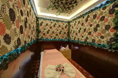 a small room with a bed with a bow on it at Orchid Hotel Al Barsha 