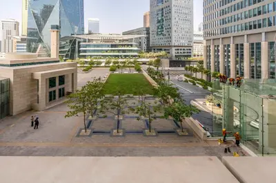 a view of a park in a city with buildings at Silkhaus newly furnished studio facing DIFC with pool and gym access in Dubai