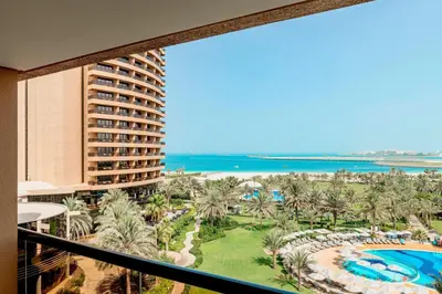 a view of the beach from the balcony of a resort at Le Royal Meridien Beach Resort & Spa Dubai in Dubai