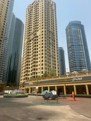 a building in a city with tall buildings at Magic JBR & Dubai marina in Dubai
