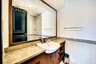 a bathroom with a sink and a mirror at Fairmont Apartments The Palm, Free access to hotel beach and pools in Dubai