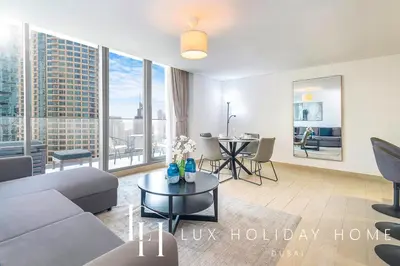 a living room with a couch and a table at LUX Contemporary Suite with Marina View 6 in Dubai