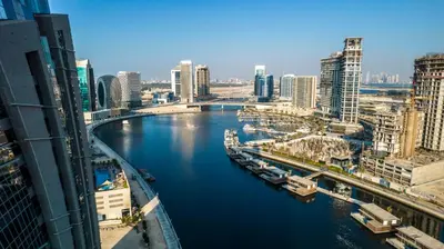 a view of a river in a city with buildings at Unlock J One Downtown Dubai in Dubai