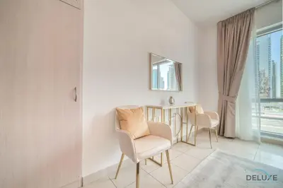 a dining room with a table and chairs at Classy 2BR at La Riviera Dubai Marina by Deluxe Holiday Homes in Dubai