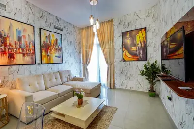 a living room with a couch and a table at Dubai marina , Success Luxury apartments, near JBR beach and metro station-daily free housekeeping included in Dubai