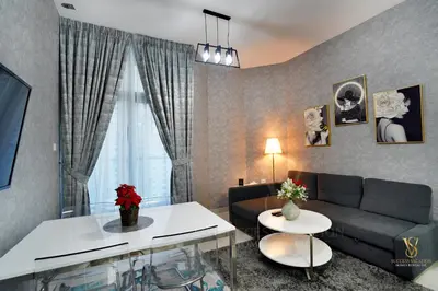 a living room with a couch and a table at Dubai marina , Success Luxury apartments, near JBR beach and metro station-daily free housekeeping included in Dubai