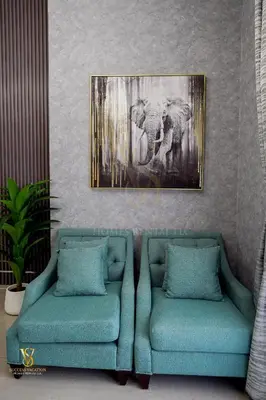 two blue chairs in a room with a painting on the wall at Dubai marina , Success Luxury apartments, near JBR beach and metro station-daily free housekeeping included in Dubai