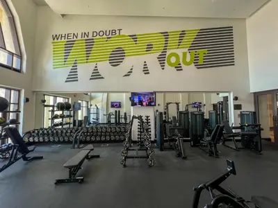 a gym with a bunch of exercise equipment in it at Durrani Homes - Arabian luxury at Souk Al Bahar besides Burj Khalifa & Dubai Mall in Dubai