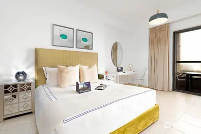a bedroom with a large bed and a bathroom at Dream Inn Apartments - Rimal JBR in Dubai