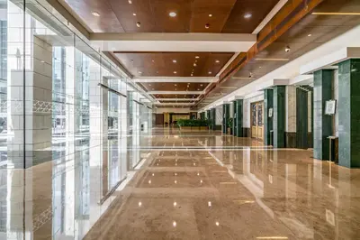 an empty hallway in a building with glass windows at Silkhaus newly furnished modern DIFC studio with balcony in Dubai