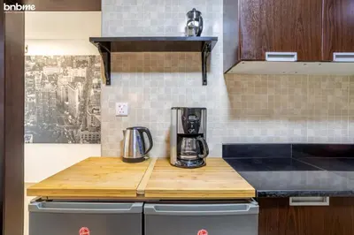 a kitchen with a counter with a coffee maker on it at bnbmehomes - The Medalist in Dubai