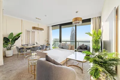 a living room with a couch and chairs and a table at Luxury 2BR Skyline Sea View Direct Mall Metro Dining Shops City Walk in Dubai