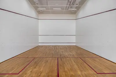 an empty room with a wooden floor and white walls at Silkhaus elegant studio with Burj Khalifa view and balcony in Dubai