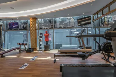 a gym with a mannequin in the middle of a room at HiGuests - Luxury Apartment in the Iconic Park Towers in Dubai