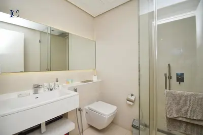 a bathroom with a toilet and a sink and a shower at Luxury Escapes - Large Studio in the heart of Dubai Marina - West Avenue in Dubai