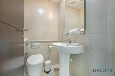 a small bathroom with a toilet and a sink at Full Marina and Ain Dubai Wheel View 1BR at The Point Dubai Marina by Deluxe Holiday Homes in Dubai