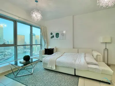 a bedroom with a bed and a large window at Full Marina and Ain Dubai Wheel View 1BR at The Point Dubai Marina by Deluxe Holiday Homes in Dubai